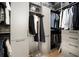Well-organized walk-in closet with custom shelving, hanging rods, and ample storage space at 28853 Seedling St, Wesley Chapel, FL 33543