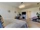 Nicely decorated bedroom featuring unique wall decor, a fireplace, and a dressing table at 2933 Maiden Grass Isle, Wesley Chapel, FL 33543