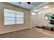 Bright bedroom with natural light, plush carpet, and a window at 2933 Maiden Grass Isle, Wesley Chapel, FL 33543