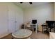 Bright office features a work-space with a desk, sewing machine and chair, plus a storage closet at 2933 Maiden Grass Isle, Wesley Chapel, FL 33543