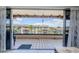 Outdoor balcony with tile floors, a view of a neighboring building, and a lovely breeze at 3021 Countryside Blvd # 45A, Clearwater, FL 33761