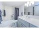 Fresh bathroom featuring a wide vanity with a white countertop and tub and shower combination at 3021 Countryside Blvd # 45A, Clearwater, FL 33761