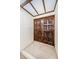 Elegant double door entry with decorative carvings and transom window overhead at 3021 Countryside Blvd # 45A, Clearwater, FL 33761