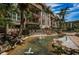 Lush condominium exterior showcasing fountain, mature landscaping, and well-maintained walking paths at 3021 Countryside Blvd # 45A, Clearwater, FL 33761