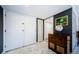 Foyer with marble floors, storage closets, and decorative accents at 3021 Countryside Blvd # 45A, Clearwater, FL 33761