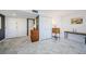 Hallway featuring white closets and marble-look tile flooring at 3021 Countryside Blvd # 45A, Clearwater, FL 33761