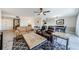 Open living room features a sofa, a dining table, and two recliners for a comfortable atmosphere at 3021 Countryside Blvd # 45A, Clearwater, FL 33761