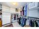 Organized walk-in closet featuring ample shelving, drawers, and hanging space for optimal storage and convenience at 3021 Countryside Blvd # 45A, Clearwater, FL 33761