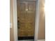 Exterior view of a wooden front door with gold number 2260, a gold door bell and door lock at 36750 Us 19 N # 4-205, Palm Harbor, FL 34684