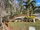 Community park space with walkway, mature trees, and lush foliage at 36750 Us 19 N # 4-205, Palm Harbor, FL 34684