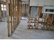 Open living room framed out and ready for renovation with the kitchen behind it at 3919 Harrisburg Ne St, St Petersburg, FL 33703