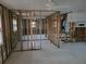 Framed-out living room ready for renovation, featuring ample natural light from windows at 3919 Harrisburg Ne St, St Petersburg, FL 33703