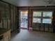 Unfinished living room showing door to the outside and open windows at 3919 Harrisburg Ne St, St Petersburg, FL 33703