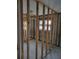 Framed-out room ready for renovation with ample natural light from dual windows at 3919 Harrisburg Ne St, St Petersburg, FL 33703