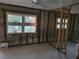 Room framed-out ready for renovation featuring large windows with backyard views at 3919 Harrisburg Ne St, St Petersburg, FL 33703