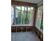 Sunroom framed out ready for renovation featuring large windows with backyard views at 3919 Harrisburg Ne St, St Petersburg, FL 33703