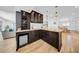 Entertainer's bar area with wine rack, glass storage, granite countertops, and a mini-fridge at 4106 W Cleveland St, Tampa, FL 33609