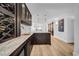 Spacious bar area showcasing wine storage, cabinetry, granite counters, and stylish pendant lighting at 4106 W Cleveland St, Tampa, FL 33609