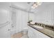 Clean bathroom features a shower-tub combo, granite countertop, and ample vanity storage at 4106 W Cleveland St, Tampa, FL 33609
