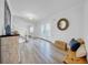 Bright foyer featuring stylish wood-look flooring, elegant staircase, and decorative elements at 4106 W Cleveland St, Tampa, FL 33609