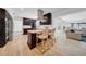 Modern kitchen features stainless steel appliances, island seating, and open floor plan at 4106 W Cleveland St, Tampa, FL 33609