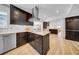Contemporary kitchen features an island with an electric cooktop and bar seating at 4106 W Cleveland St, Tampa, FL 33609