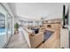 Spacious living room with a stone fireplace, hardwood floors, large windows, and a pool view at 4106 W Cleveland St, Tampa, FL 33609