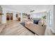 Bright, open living room with comfortable seating, a large screen TV, and access to the outdoors at 4106 W Cleveland St, Tampa, FL 33609