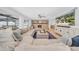Bright living room showcases stone fireplace, hardwood floors, and comfortable sectional sofa at 4106 W Cleveland St, Tampa, FL 33609
