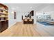 Open-concept living area with hardwood floors, modern decor, and seamless flow to the kitchen at 4106 W Cleveland St, Tampa, FL 33609