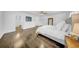 Expansive main bedroom with hardwood floors, fan, and neutral decor at 4106 W Cleveland St, Tampa, FL 33609