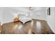 Bright main bedroom with hardwood floors, ceiling fan, and a large window offering natural light at 4106 W Cleveland St, Tampa, FL 33609