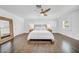 Bedroom featuring hardwood floors, a ceiling fan, and a mirror at 4106 W Cleveland St, Tampa, FL 33609