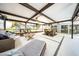 Large screened-in patio provides a comfortable outdoor living space and view of backyard play area at 4106 W Cleveland St, Tampa, FL 33609