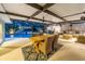 Covered patio features outdoor dining and lounge area with a view of the pool and spa at 4106 W Cleveland St, Tampa, FL 33609