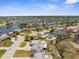Expansive aerial view of a waterfront community featuring numerous canals and residential homes at 4210 Headsail Dr, New Port Richey, FL 34652