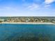 Breathtaking aerial view of a coastal community with direct access to the beach and sparkling ocean views at 4210 Headsail Dr, New Port Richey, FL 34652