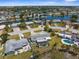 An aerial view shows neighborhood homes with pools and canal access; a boater's paradise at 4210 Headsail Dr, New Port Richey, FL 34652