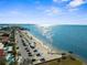 Coastal scene featuring a beach, coastal road and the open ocean at 4210 Headsail Dr, New Port Richey, FL 34652
