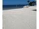 Community beach with shade structures and picnic areas for outdoor relaxation by the water at 4210 Headsail Dr, New Port Richey, FL 34652