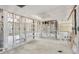 Spacious living room under construction featuring an open floor plan and a unique ceiling fixture at 4210 Headsail Dr, New Port Richey, FL 34652