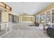 Spacious living area shows partially renovated space, bright windows, and fan at 4210 Headsail Dr, New Port Richey, FL 34652