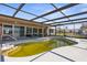The property includes a screened-in pool area, providing a private outdoor retreat, but the pool needs cleaning at 4210 Headsail Dr, New Port Richey, FL 34652