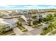 Stunning aerial view of a home in a waterfront community with palm trees and well manicured lawns at 422 Islebay Dr, Apollo Beach, FL 33572