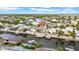 Waterfront property with boat dock, surrounded by lush landscaping, serene canal, and other waterfront homes at 422 Islebay Dr, Apollo Beach, FL 33572