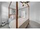 Bedroom featuring neutral walls, carpet flooring, ceiling fan, closet with louvered doors and a 4 poster bed at 422 Islebay Dr, Apollo Beach, FL 33572