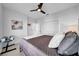 Bedroom featuring neutral walls, carpet flooring, ceiling fan, and closet with louvered doors at 422 Islebay Dr, Apollo Beach, FL 33572