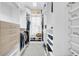 Walk-in closet features custom white shelving and drawers for ample storage at 422 Islebay Dr, Apollo Beach, FL 33572
