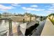 Boat on a lift features great water access and waterfront views in this beautiful property at 422 Islebay Dr, Apollo Beach, FL 33572