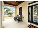 Cozy front porch with seating, offering an inviting outdoor space with view of the neighborhood at 422 Islebay Dr, Apollo Beach, FL 33572